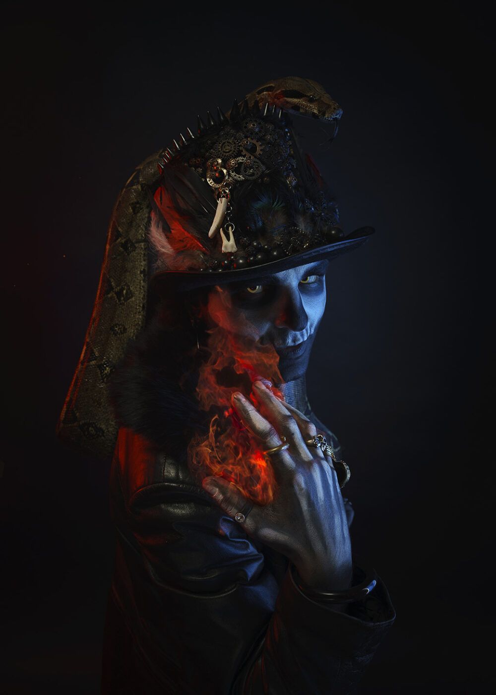 Baron Samedi Holding a Fire with Python on his hat